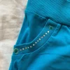 blaue stoff shorts mit steinen