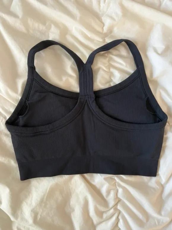 dark blue sports bra thick straps structured pretty back removable pads
