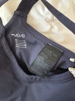 dark blue sports bra thick straps structured pretty back removable pads