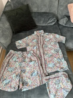 For men: beach shirt and shorts with bag included