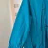 Nieuwe lange turquoise regenjas EU maat 52 54