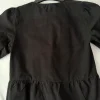 schwarze Bluse mit Puffärmeln und Schleifen