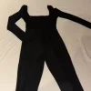 Schwarzer Jumpsuit - Größe 36